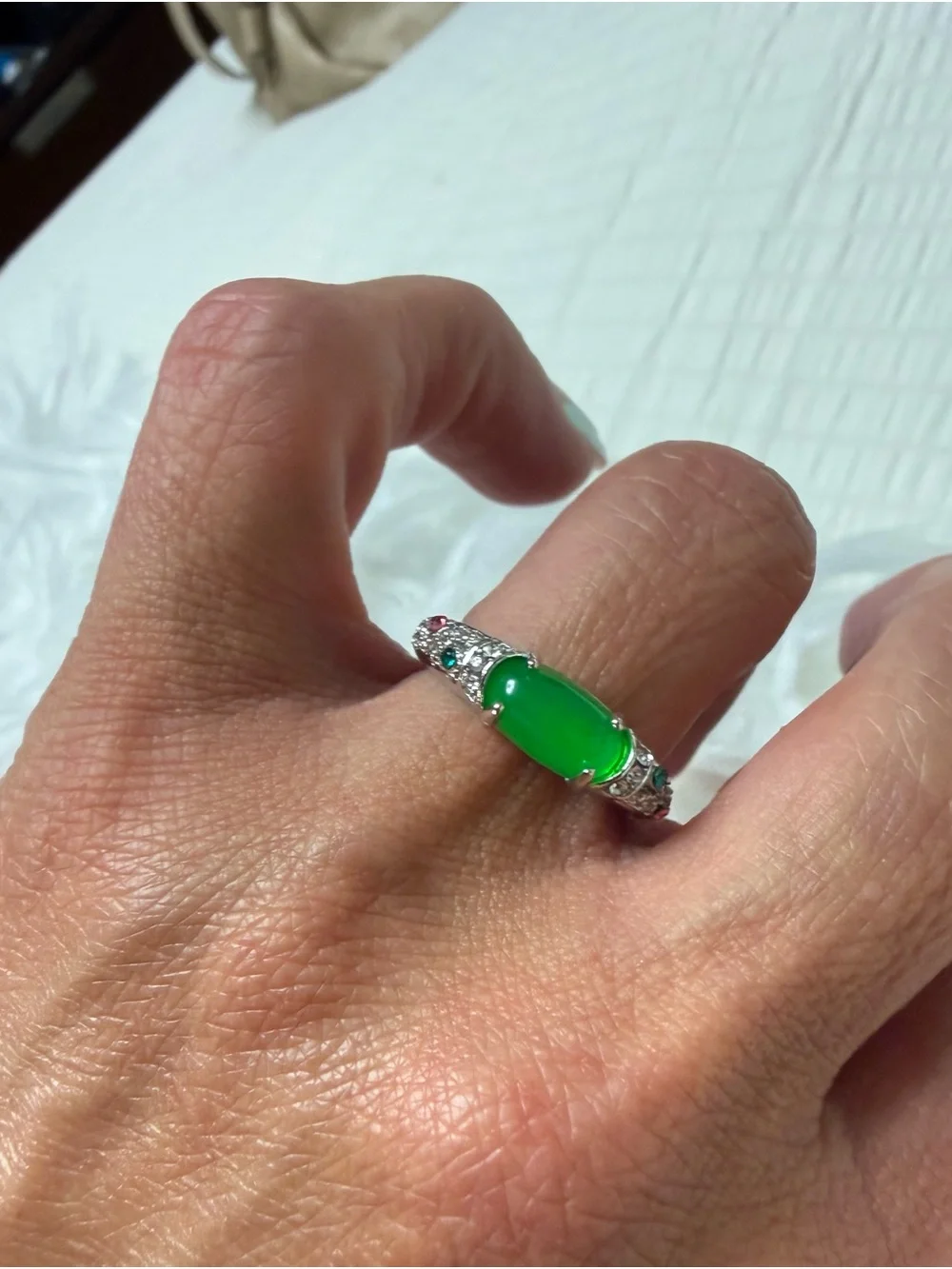 Emerald Green Cabochon Ring with Sparkling Accents